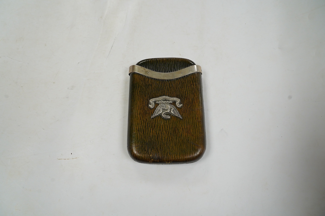 An Edwardian silver mounted green leather cigar case with crest and motto 'Candidior Nive' (whiter than snow), Alfred Clark, London, 1903, retailed by Clark of New Bond Street, 13.7cm. Condition - poor to fair